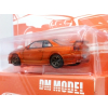 Nissan Skyline GT-R R34 orange - skala 1:64 - DM Model